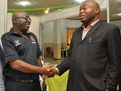 (L-r): Dr. Bolaji Uthman, director general, Lagos State Archives Bureau (LASRAB) exchanging pleasantries with Mr. Pious Otakpo, programme Manager, Institute of Information Management during 2013 RIMA Award in Lagos.